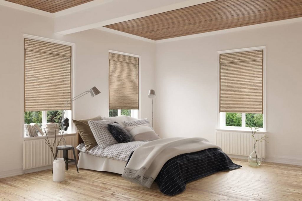 roman shades in a bedroom